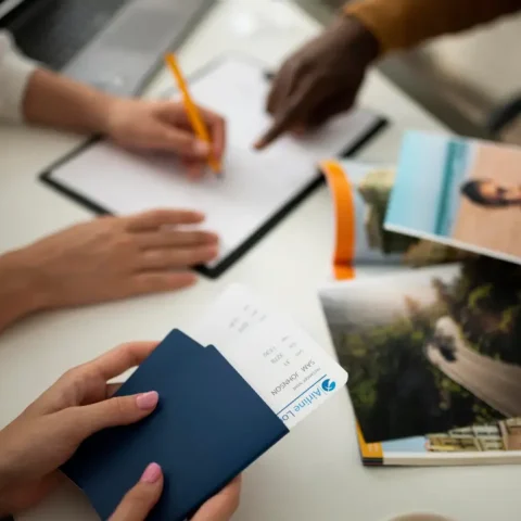close-up-hand-signing-document-with-pencil