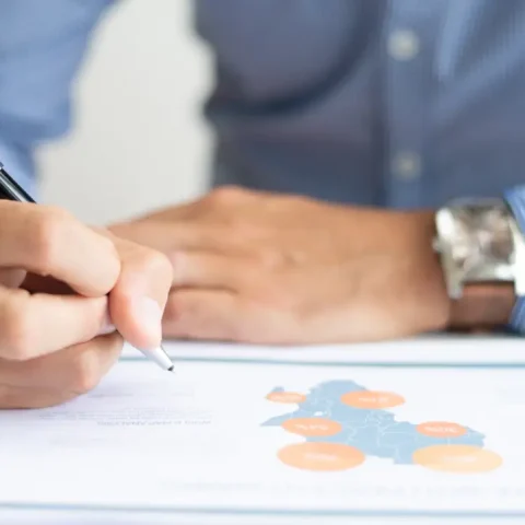 closeup-business-man-studying-map-chart