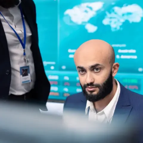 financial-analyst-works-resource-allocation-plans-with-his-staff