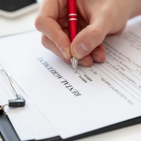 high-angle-man-signing-contract-new-house