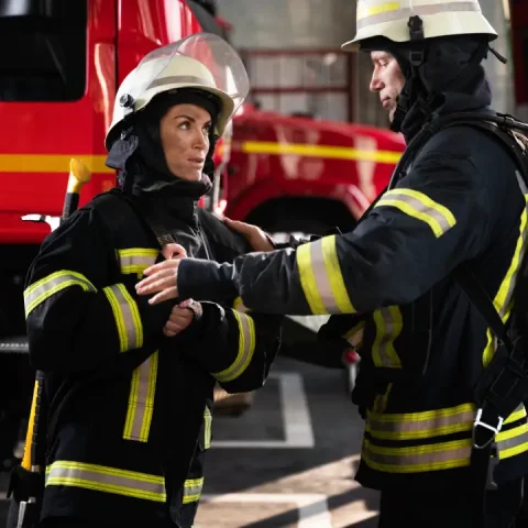 male-female-firefighters-working-together-suits-helmets