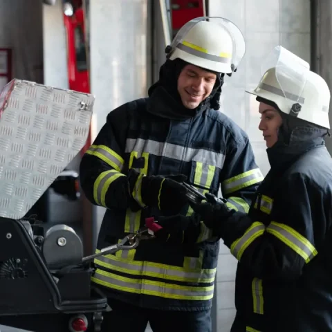 male-female-firefighters-working-together-suits-helmets