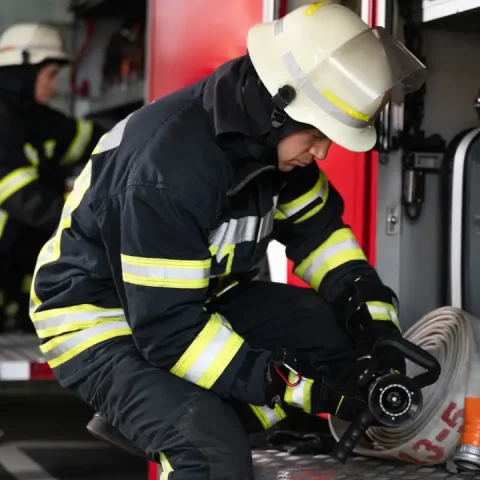 male-female-firefighters-working-together-suits-helmets