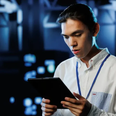 man-data-center-with-tablet