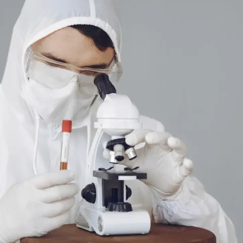 man-protective-suit-glasses-working-laboratory