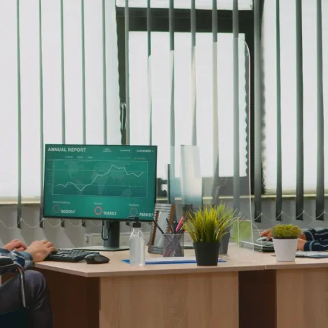 paralysed-financial-worker-comming-wheelchair-new-normal-business-office-with-protection-mask-waving-colleague-immobilized-freelancer-corporate-company-respecting-social-distance