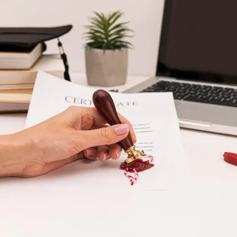 person-using-wax-seal-graduation-diploma-certificate (1)