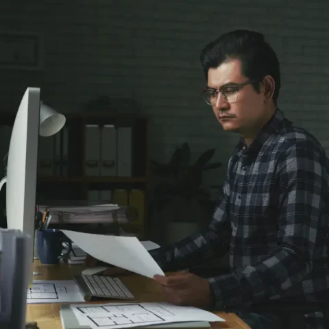 serious-man-working-with-documents-his-office