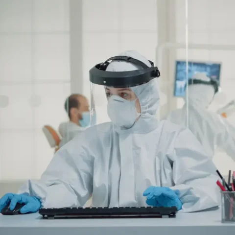 stomatology-assistant-sitting-desk-using-computer