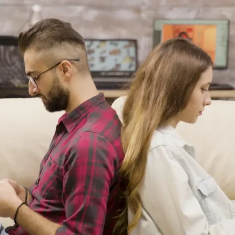 upset-couple-sitting-back-back-ignoring-each-other-couple-sitting-couch