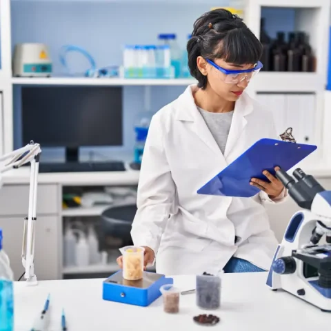 young-woman-scientist-measuring-liquid-laboratory